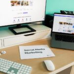 Modern workstation displaying viral marketing content and social media marketing tools on desktop and laptop screens.